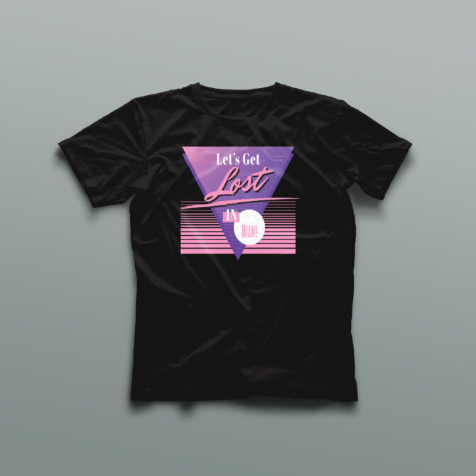 Black t-shirt featuring a purple triangle with the words “Let’s Get Lost in Miami” in retro 80s-style font, pink horizontal stripes, and pastel highlights representing a vintage South Beach aesthetic.